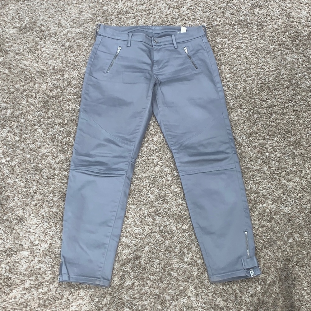 Gray ankle skinny jeans; mid-rise; slightly worn